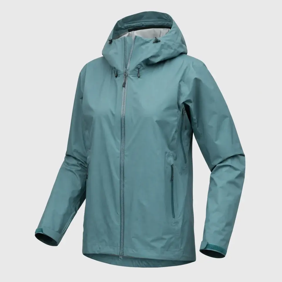 SummitArc teal three-layer hiking rain shell with an adjustable hood
